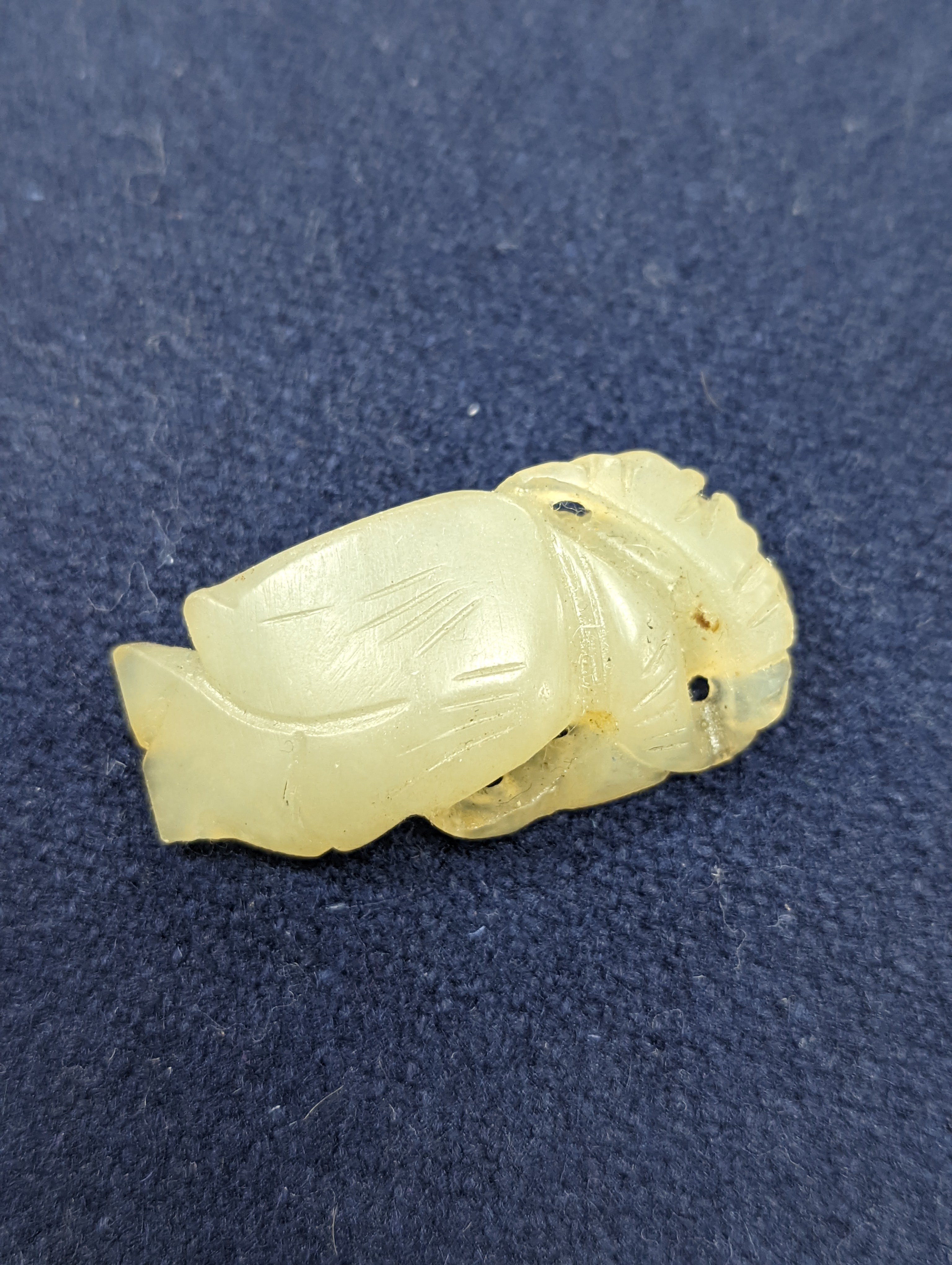 A Chinese jade belt hook, 12.5cm an archer's ring and figure, a stone cup and a glass snuff bottle